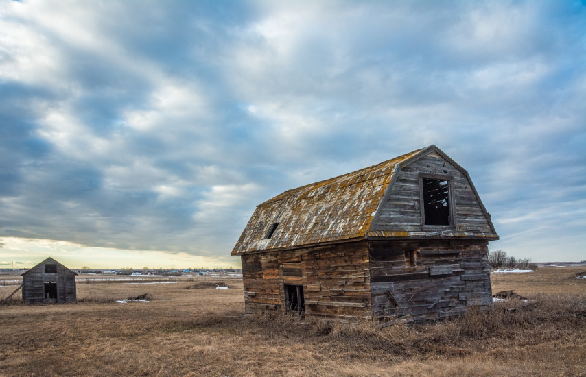 An abandoned barn near Keoma, Alberta - With a chinook overhead.